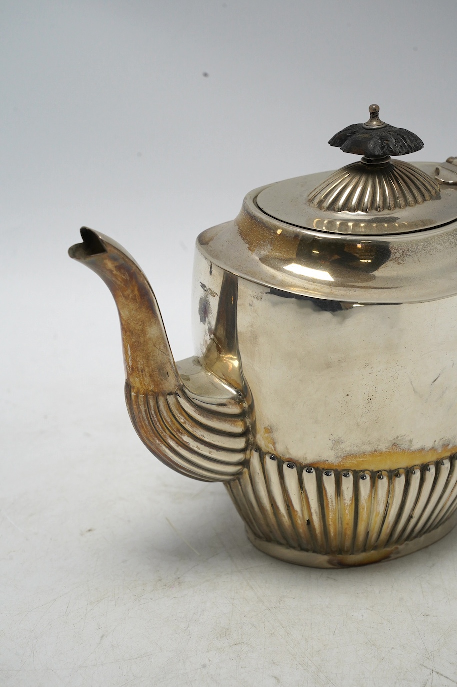 A late Victorian demi-fluted silver oval teapot, by Henry Bourne, Birmingham, 1896, gross weight 11.4oz. Condition - fair